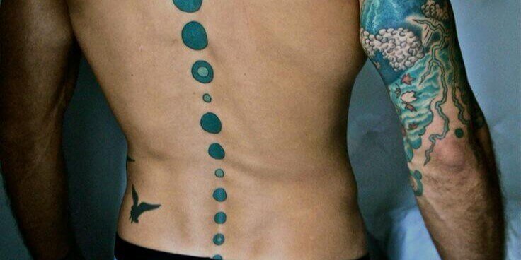 Very colorful tattoo on man's back